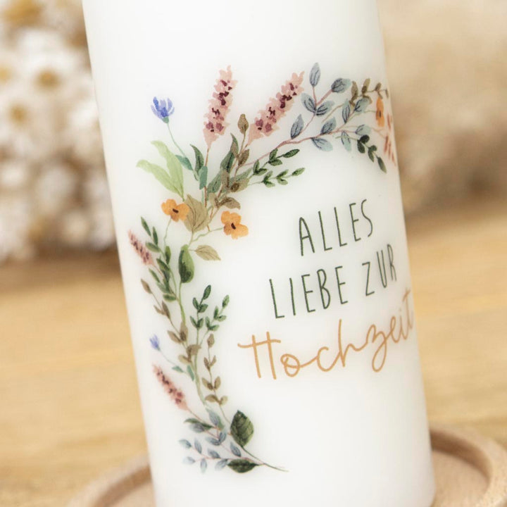 Kerze zur Hochzeit mit modernem Blumenkranz-Motiv in Weißtönen
