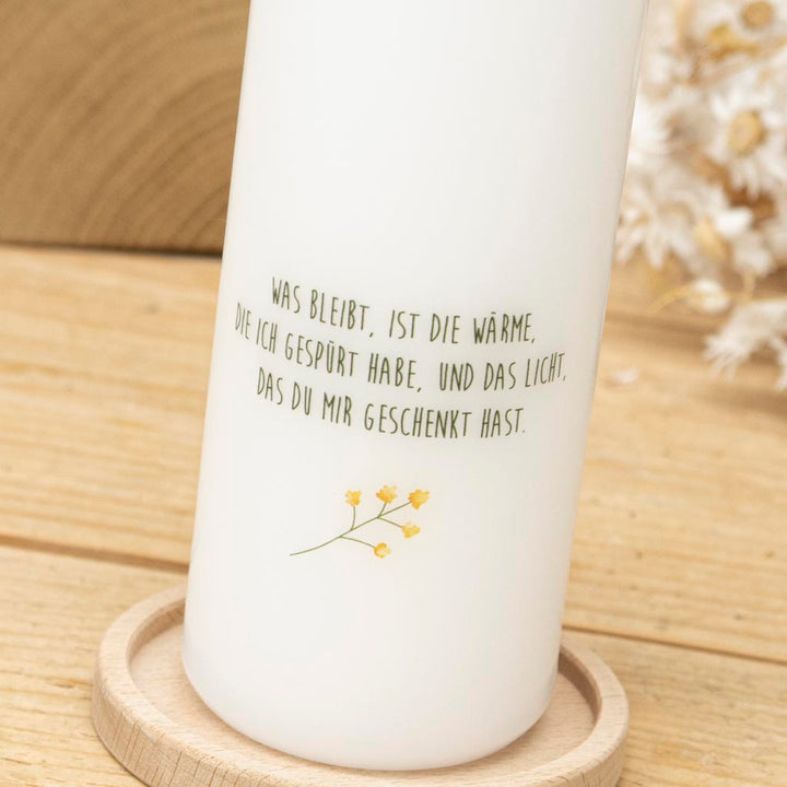 Rückseite der Trauerkerze Sonnenblume mit persönlichem Spruch