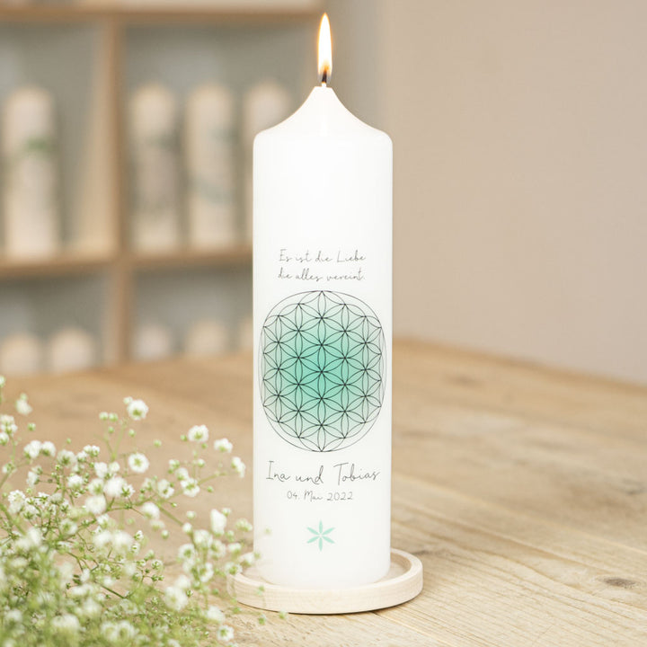 Hochzeitskerze Blume des Lebens mit türkisem Farbverlauf und Namen