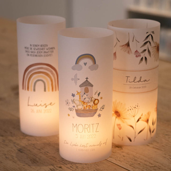 3 Lichthüllen zur Taufe mit unterschiedlichen Motiven als Beispiel - sie leuchten